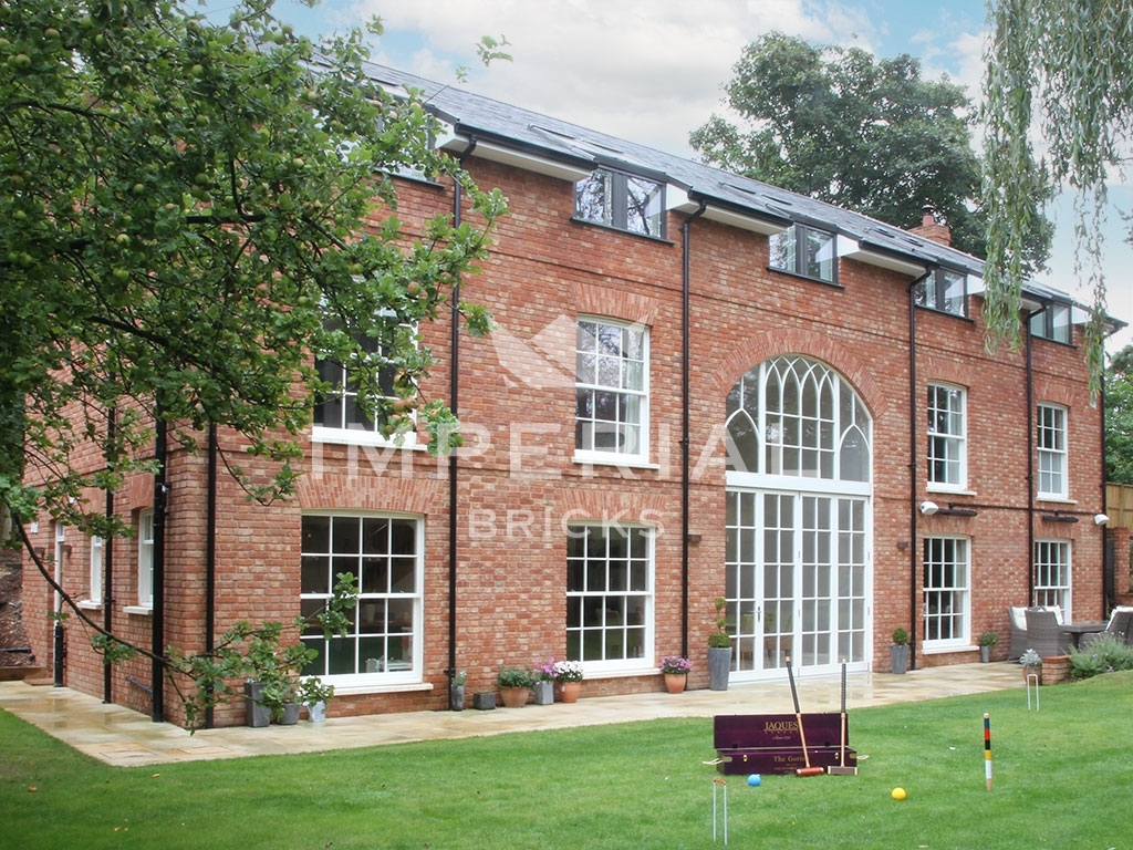 Rear of three storey, Georgian style self build home, built using Reclamation Soft Red handmade bricks.