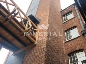 Close up of new passenger lift at Grade II* listed Quarry Bank Mill, built using a bespoke blend of Reclamation Red Handmade bricks.