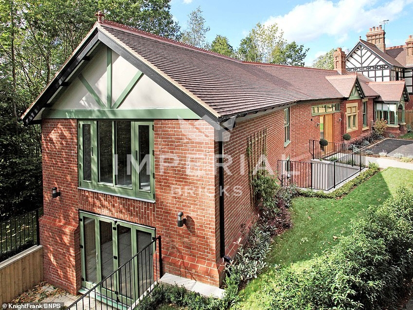 Angle view of former railway ticket office, restored and converted into a residential home using Soft Red handmade bricks.