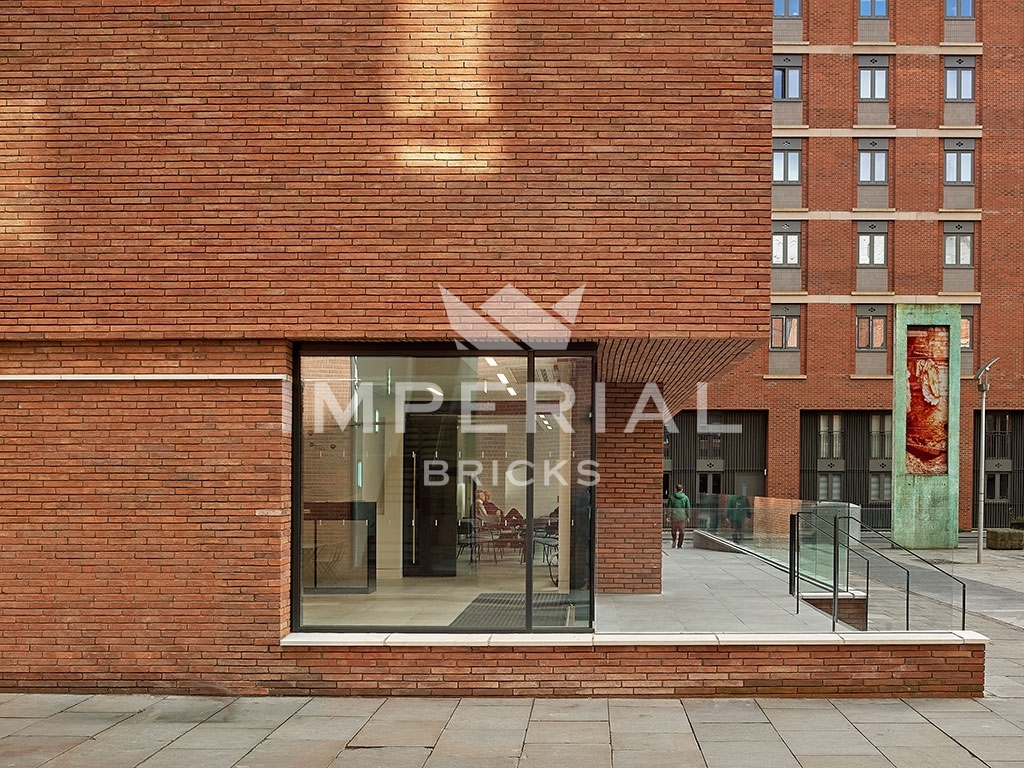 Side of extension of Halle St Peter's church, built using a bespoke blend of red linear handmade bricks.
