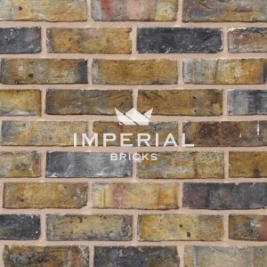 Dark Weathered Original London Stock bricks shown in a wall. The bricks have tonal weathering.