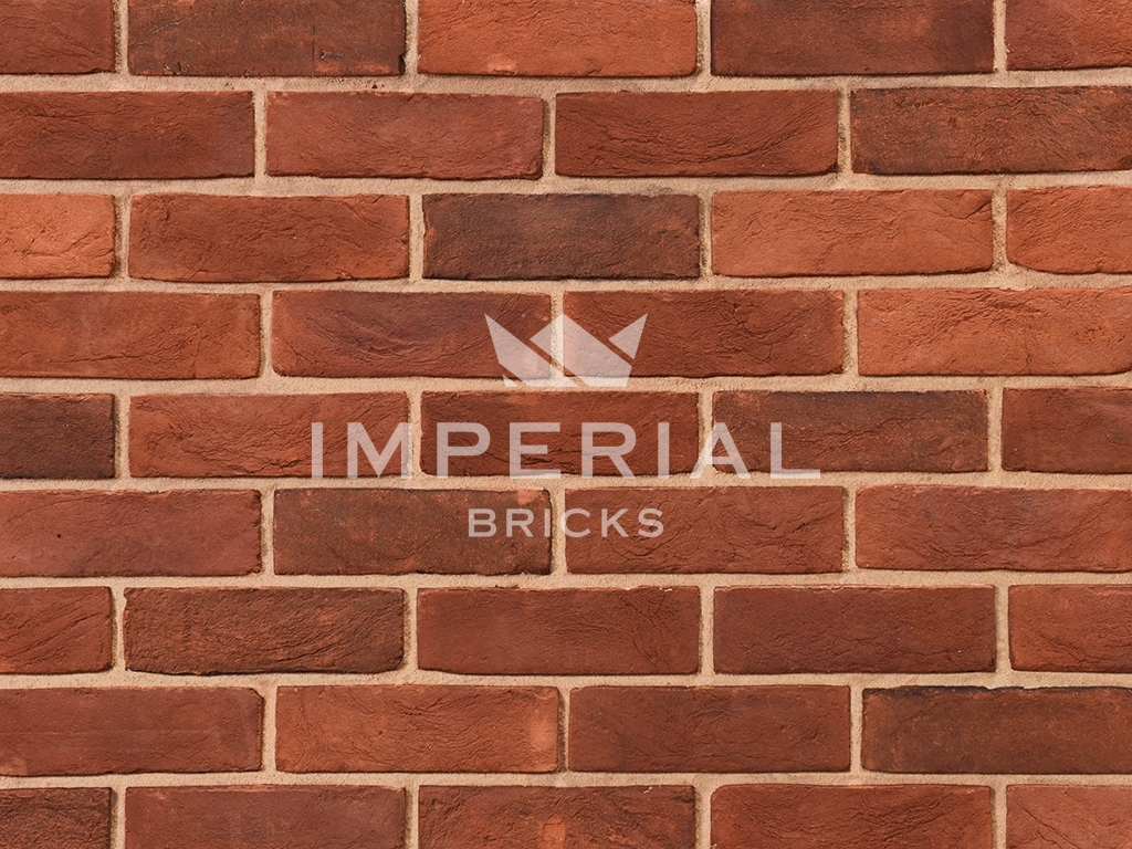 Capital Blend Soft Red bricks shown in a wall. The bricks are red with a blend of some darker faces.