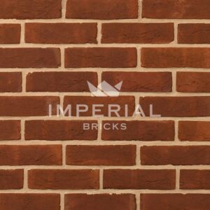 Georgian handmade bricks shown in a wall. The bricks are red, with orange and subtle plum tones.