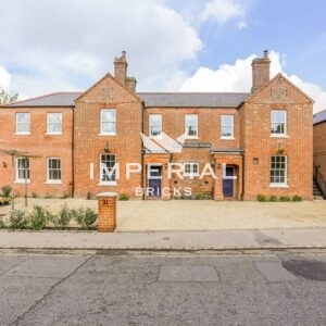 Extension of residential homes, built using Heritage Soft Orange handmade bricks. The extension is shown to the left of the building.