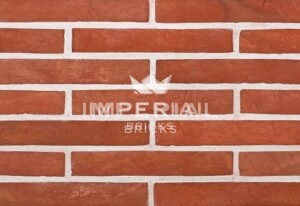 Soft Red Multi Linear bricks shown in a wall. The bricks have red shade variations.