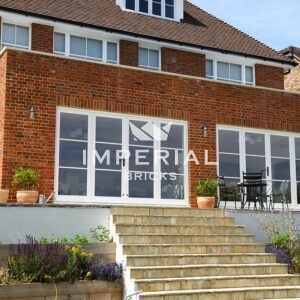 Large residential home built using Reclamation Weathered Soft Red handmade bricks.