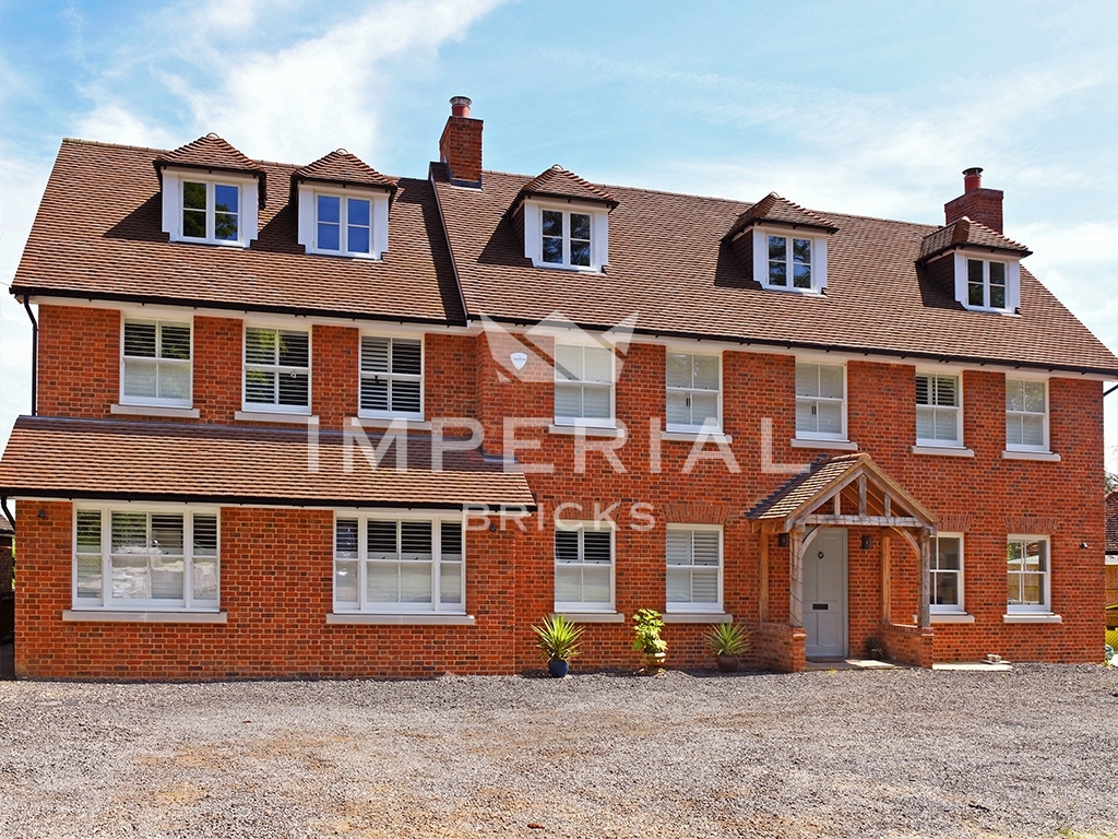 Large residential home built using Reclamation Weathered Soft Red handmade bricks.