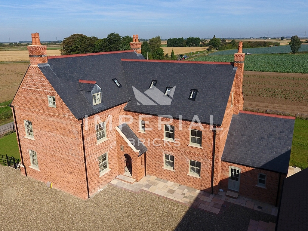 Large residential self-build, built using Farmhouse Orange handmade bricks.