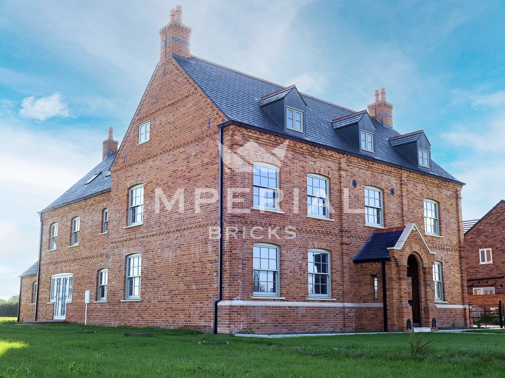 Large residential home built using Farmhouse Orange handmade bricks.