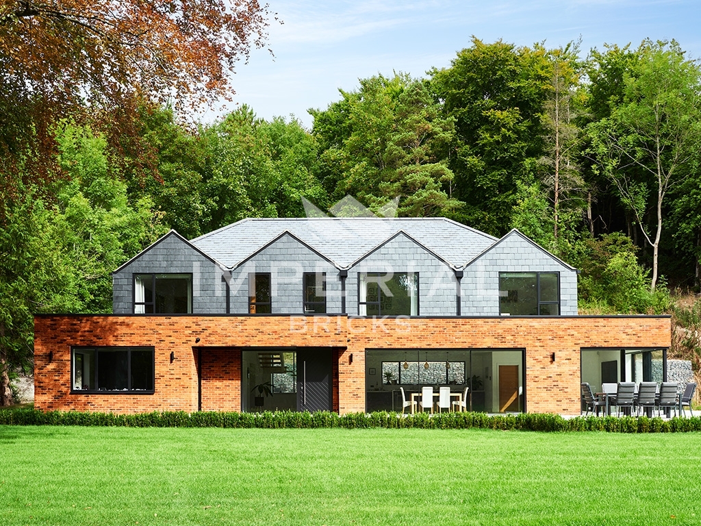 Front angle of large residential self-build, built using Country Blend handmade bricks.