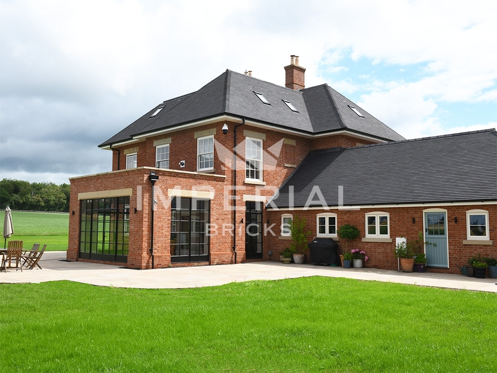 Rear of large residential build, built using Soft Red handmade bricks.