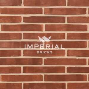 Linear 111 handmade bricks shown in a wall. The bricks are red wth subtle shade variations and fine creasing on the faces.