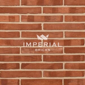 Linear 120 handmade bricks shown in a wall. The bricks are red with prominent shade variations and smooth waterstruck faces with soft creases.