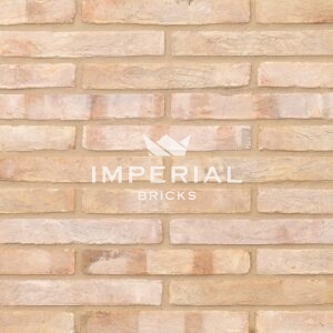 Linear 135 handmade bricks shown in a wall. The bricks are cream/white with subtle pale pink overburns.
