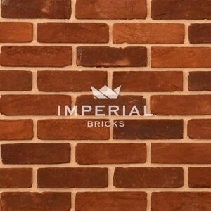 Reclamation Weathered Red Rubber bricks shown in a wall. The bricks have a textured finish.