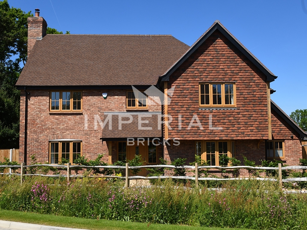 Residential new build property, built using Tumbled Reclamation Red Handmade bricks.