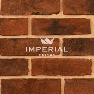 Urban Weathered bricks shown in a wall. The bricks have a red base colour with a sooted and dark weathered finish.
