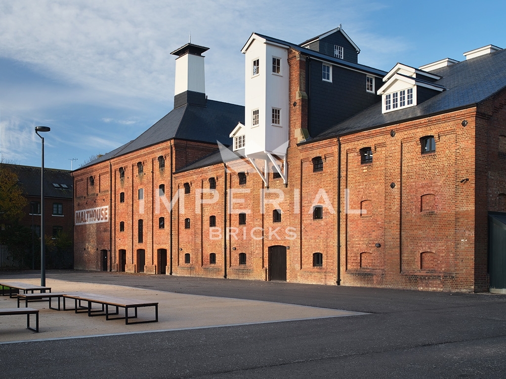 Side angle of restored historical derelict building, built using Weathered Pre War Common bricks.