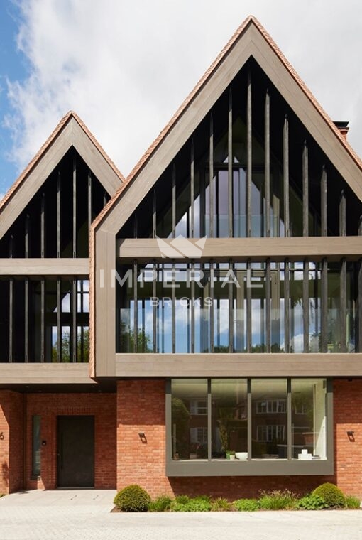 Self build home, with modern architectural design details, built using Capital Blend Soft Red handmade bricks