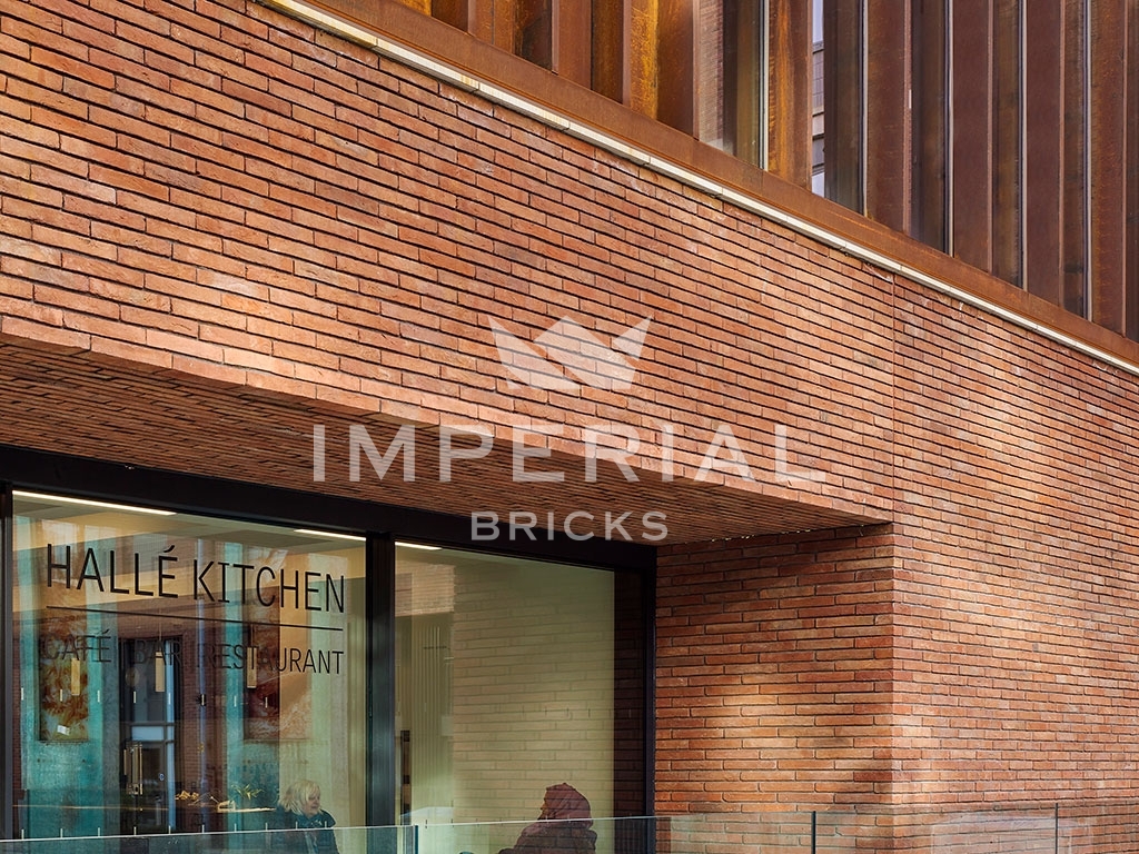 Entrance of Halle St Peters in Manchester, which is cladded using linear size handmade brick slips.