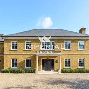 Front view of Georgian new build, built using Conservation Yellow Stock handmade bricks.