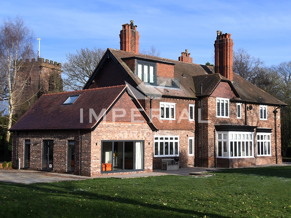 Rear side of a large family home, built using Weathered Scotch Pre War extruded bricks.