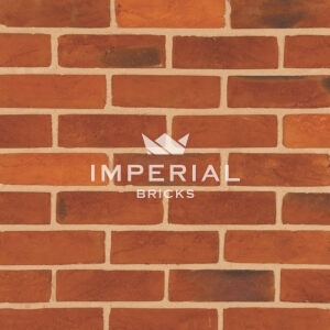 Red Rubber Multi handmade bricks shown in a wall.