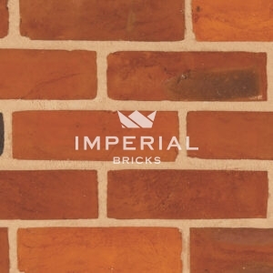 Red Rubber Multi bricks shown in a wall close up.