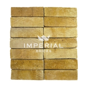 Berkeley Yellow bricks shown in a wall, the bricks feature slight creasing and authentic coal spotting on the faces.