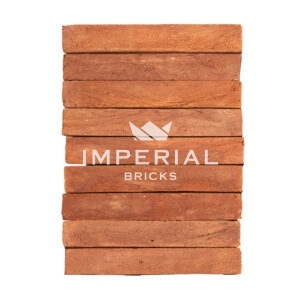 Hampton Red elongated bricks shown in a wall, are red bricks with textured faces.