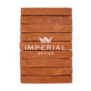 Milton Orange handmade elongated bricks shown in a wall. The bricks are a soft orange shade with natural colour variations and feature textured faces.