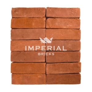 Milton Orange handmade bricks shown in a wall. The bricks are a soft orange shade with natural colour variations and feature textured faces.