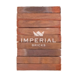 Wadhurst Multi handmade elongated bricks shown in a wall, featuring a tonal range from red to plum, with blue flashing throughout.