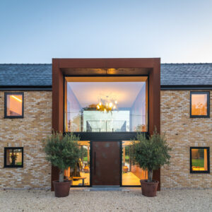 Front shot of Grand Designs property built using Tumbled Cambridge Buff handmade bricks.