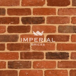 Colemere Reclamation red handmade bricks shown in a wall. The bricks feature a textured finish with a mix of red and brown tones.