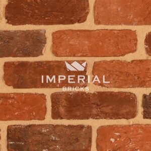 Colemere Reclamation red handmade bricks shown in a wall. The bricks feature a textured finish with a mix of red and brown tones.