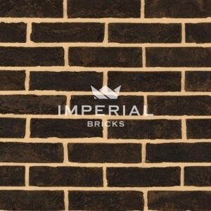 Sapphire Black bricks shown in a wall. The bricks feature dark brown and grey hues.