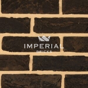 Sapphire Black bricks shown in a wall close up. The bricks feature dark brown and grey hues.