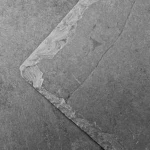 Ullswater roofing slate shown on a roof. The slate is a blue grey colour with a light textured finish.