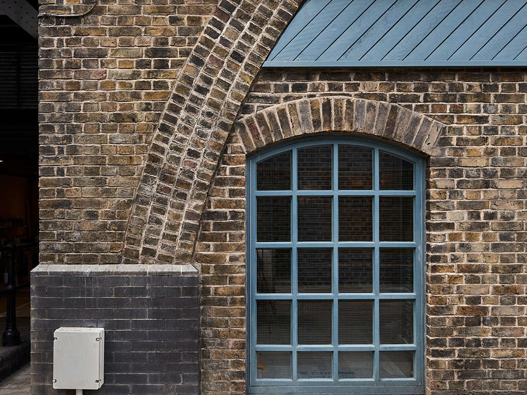 Example of heavily weathered yellow brickwork. The bricks are yellow handmade and look 'dirty' from weathering and sooting.