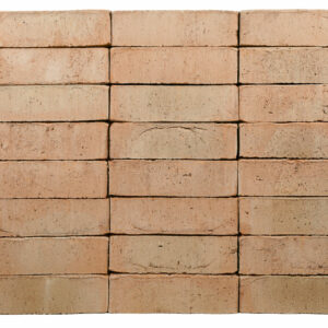 Old Saxon Buff bricks shown in a wall, the bricks have a smooth texture and subtle creasing on the faces.