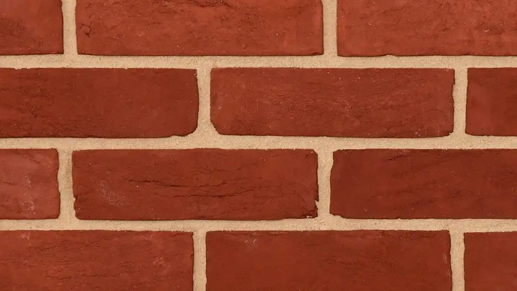 Example of red stock bricks used in London. The handmade bricks have fine creasing on the faces with a sanded texture.