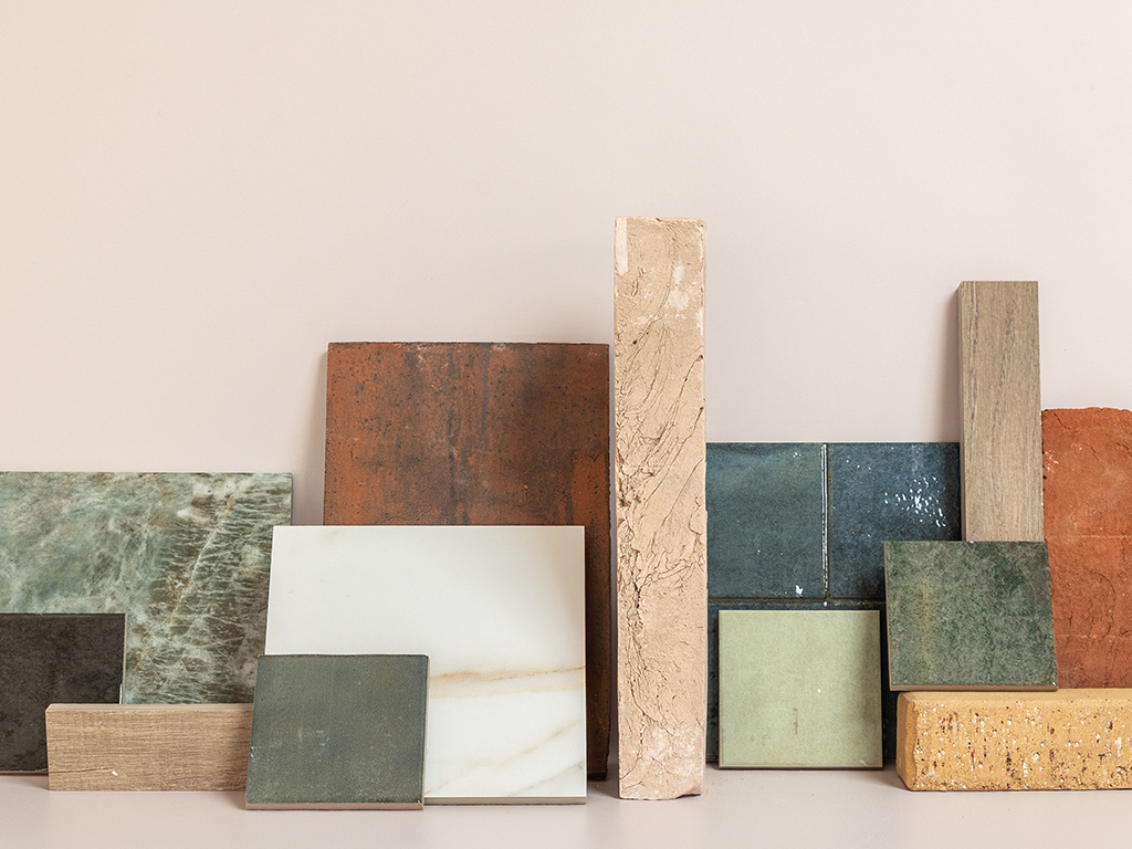 Display of building materials including bricks, brick slips, clay roof tiles, porcelain paving and clay pavers.