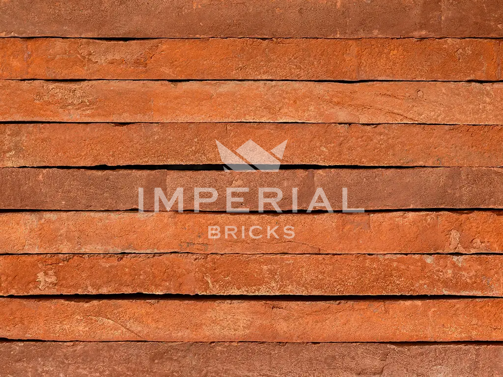 Farmhouse Orange handmade linear bricks shown in a wall.