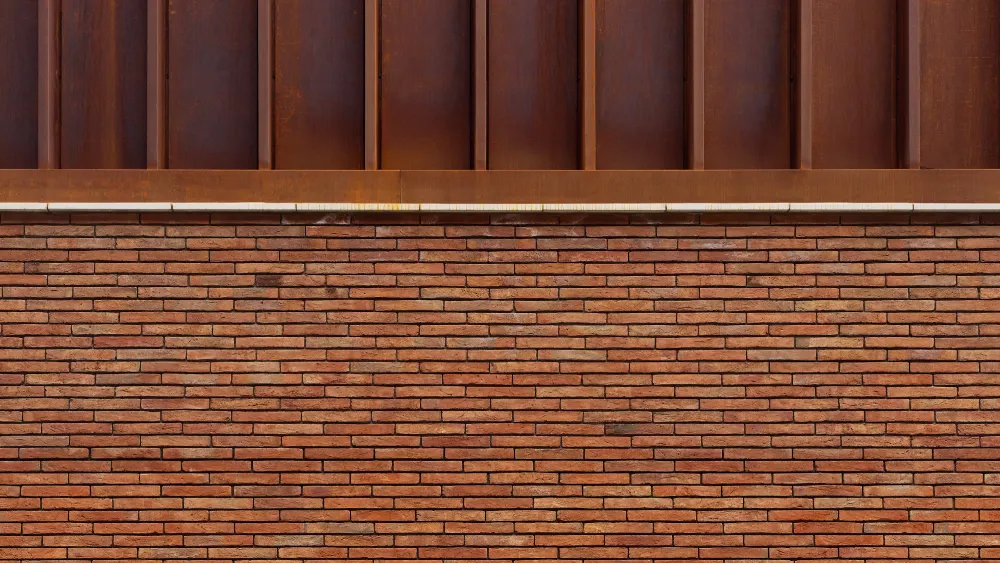 Wall of Red Multi Handmade Linear Bricks below an architectural structure. This close up image is part of the Halle St Peter's extension in Manchester.